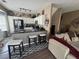 Open kitchen with white cabinets, dark countertops, and modern stainless steel appliances at 1346 Pilgrim Lake Dr, Cumming, GA 30040