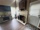 Cozy living room with a fireplace, TV, and natural light at 1346 Pilgrim Lake Dr, Cumming, GA 30040