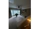Bright living room with plush carpet, ceiling fan, and bay window seating area at 1346 Pilgrim Lake Dr, Cumming, GA 30040