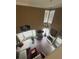 Open living room with high ceilings, large windows, hardwood floors, and cozy decor at 1346 Pilgrim Lake Dr, Cumming, GA 30040