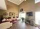 Bright living room with hardwood floors, sectional sofa, and large windows at 1346 Pilgrim Lake Dr, Cumming, GA 30040