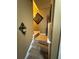 Carpeted staircase with railing leading upstairs, decorated with wall art at 1346 Pilgrim Lake Dr, Cumming, GA 30040