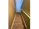 Carpeted staircase with railing leading upstairs, well lit at 1346 Pilgrim Lake Dr, Cumming, GA 30040