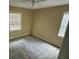 Bedroom featuring carpet, natural light from two windows, and a ceiling fan at 1932 Pharrs Rd, Snellville, GA 30078