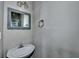 Bathroom featuring sink, framed mirror, and towel rack at 5036 Weatherstone Drive, Buford, GA 30519
