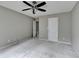 Bedroom with neutral walls, carpet, ceiling fan, and a closet door at 5036 Weatherstone Drive, Buford, GA 30519