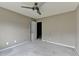 Bedroom with neutral walls, carpet, ceiling fan, and a closet door at 5036 Weatherstone Drive, Buford, GA 30519