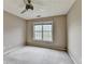 Bedroom with neutral walls, carpet, ceiling fan, and a window at 5036 Weatherstone Drive, Buford, GA 30519