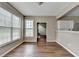 Dining room with a view through to the kitchen and stairway, complimented by hardwood floors at 5036 Weatherstone Drive, Buford, GA 30519