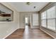 Dining room with view to kitchen and lots of windows, with neutral colors and hardwood floors at 5036 Weatherstone Drive, Buford, GA 30519