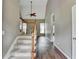 Welcoming foyer featuring hardwood floors, staircase, and high ceilings at 5036 Weatherstone Drive, Buford, GA 30519
