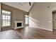 Living room with fireplace, vaulted ceiling and hardwood floors at 5036 Weatherstone Drive, Buford, GA 30519