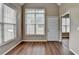 Vaulted ceiling and lots of sunlight make this sunroom a cozy retreat with wood-look floors at 5036 Weatherstone Drive, Buford, GA 30519