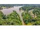 Picturesque aerial view showcasing waterfront homes surrounded by lush trees and serene waterways at 610 Lake Dr, Snellville, GA 30039