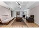 Finished basement with light paint, wood floors, large couch, chair, and area rug at 610 Lake Dr, Snellville, GA 30039