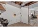 Unfinished basement utility area with white walls and access to the finished area at 610 Lake Dr, Snellville, GA 30039