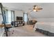 Spacious bedroom featuring ceiling fan, TV, and study area with unique architectural details at 610 Lake Dr, Snellville, GA 30039