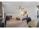 Bright bedroom with ceiling fan, TV, and study area with a cozy seating area at 610 Lake Dr, Snellville, GA 30039