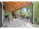 Outdoor deck area with seating, stairs, and wooded views at 610 Lake Dr, Snellville, GA 30039