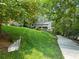 Exterior of home featuring luscious green lawn and winding driveway at 610 Lake Dr, Snellville, GA 30039