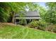 Charming home with inviting curb appeal, featuring lush landscaping and a cozy front porch at 610 Lake Dr, Snellville, GA 30039