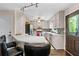 Well-lit kitchen with white cabinets, stainless steel appliances, and breakfast bar seating at 610 Lake Dr, Snellville, GA 30039