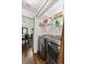 Convenient laundry room with modern washer and dryer, plus shelving for storage at 610 Lake Dr, Snellville, GA 30039