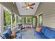 Relaxing screened porch with cozy seating, outdoor views, and a ceiling fan at 610 Lake Dr, Snellville, GA 30039