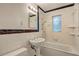 Tiled bathroom featuring a classic pedestal sink and shower-over-tub combo at 1400 Chalmette Ne Dr # 2, Atlanta, GA 30306