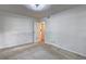 Bedroom with a closet, a door leading to another room, and plain white walls at 1400 Chalmette Ne Dr # 2, Atlanta, GA 30306