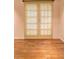 Bedroom featuring hardwood flooring and bright natural light coming through window at 1400 Chalmette Ne Dr # 2, Atlanta, GA 30306