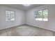 A bedroom with white walls and two windows lets in natural light at 1400 Chalmette Ne Dr # 2, Atlanta, GA 30306