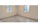 A bedroom with two windows providing natural light to the space at 1400 Chalmette Ne Dr # 2, Atlanta, GA 30306