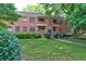 Charming brick building with landscaped front yard and a variety of plants and greenery at 1400 Chalmette Ne Dr # 2, Atlanta, GA 30306