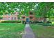 Classic brick building surrounded by mature trees and lush lawn at 1400 Chalmette Ne Dr # 2, Atlanta, GA 30306