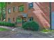 Brick building with a dark green door and awning at 1400 Chalmette Ne Dr # 2, Atlanta, GA 30306