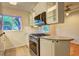 Modern kitchen with stainless steel oven and cooktop, sleek microwave, and white cabinets at 1400 Chalmette Ne Dr # 2, Atlanta, GA 30306