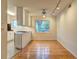 Bright eat-in kitchen with a window view, track lighting, and hardwood floors offers a cozy dining space at 1400 Chalmette Ne Dr # 2, Atlanta, GA 30306