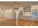Open living space with hardwood floors, recessed lighting, and built-in shelving at 1400 Chalmette Ne Dr # 2, Atlanta, GA 30306