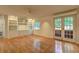 Bright living room featuring hardwood floors, built-in cabinets, and French doors at 1400 Chalmette Ne Dr # 2, Atlanta, GA 30306
