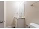 Bathroom featuring granite vanity top with cabinet, modern mirror and fixtures, and toilet at 1496 Indian Forest Ct, Stone Mountain, GA 30083