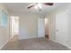 This bedroom features a ceiling fan and an open doorway leading to an adjacent room at 1496 Indian Forest Ct, Stone Mountain, GA 30083
