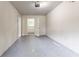 View of an empty garage with concrete floor and white walls at 1496 Indian Forest Ct, Stone Mountain, GA 30083