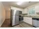 Modern kitchen with stainless steel appliances and granite countertops at 1496 Indian Forest Ct, Stone Mountain, GA 30083