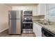 Well-equipped kitchen with stainless steel appliances and ample cabinet space at 1496 Indian Forest Ct, Stone Mountain, GA 30083