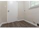 This laundry room has vinyl flooring, base trim, and a white door on the left at 1496 Indian Forest Ct, Stone Mountain, GA 30083