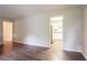 Bright, open living area with hardwood flooring and a view into the kitchen at 1496 Indian Forest Ct, Stone Mountain, GA 30083