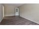 Empty room with wood flooring and a door with a window at 1496 Indian Forest Ct, Stone Mountain, GA 30083