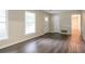 Well-lit living room featuring wood-look floors and a doorway at 1496 Indian Forest Ct, Stone Mountain, GA 30083