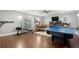 Basement featuring a ping pong table, a dining table, and workout equipment at 2730 Samples Rd, Cumming, GA 30041